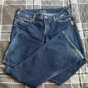 Silver Brand Distressed Blue Jeans Flare Hemline